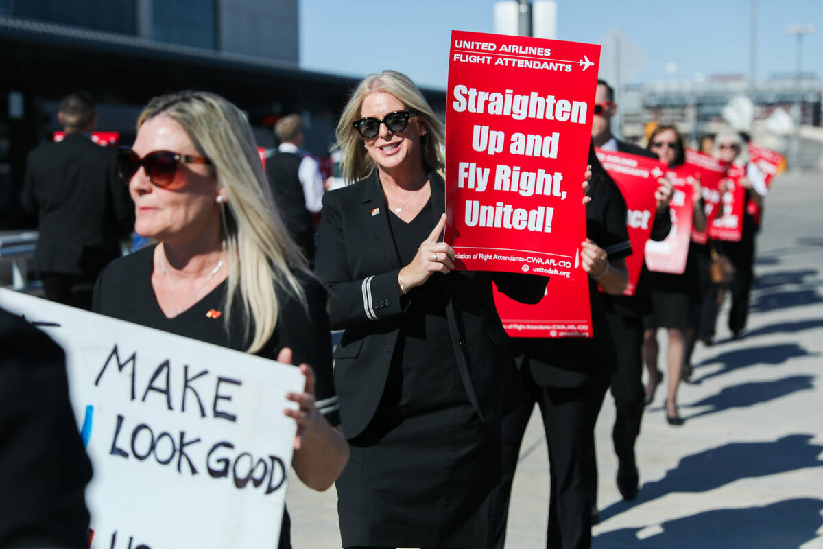 Neena Boswel, second right, participates in a picket line march alongside other flight attendan ...