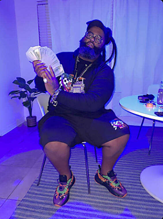 Patrick Earl Williams, a rapper known as "BigRigBaby," is seen in a photo from his website that ...