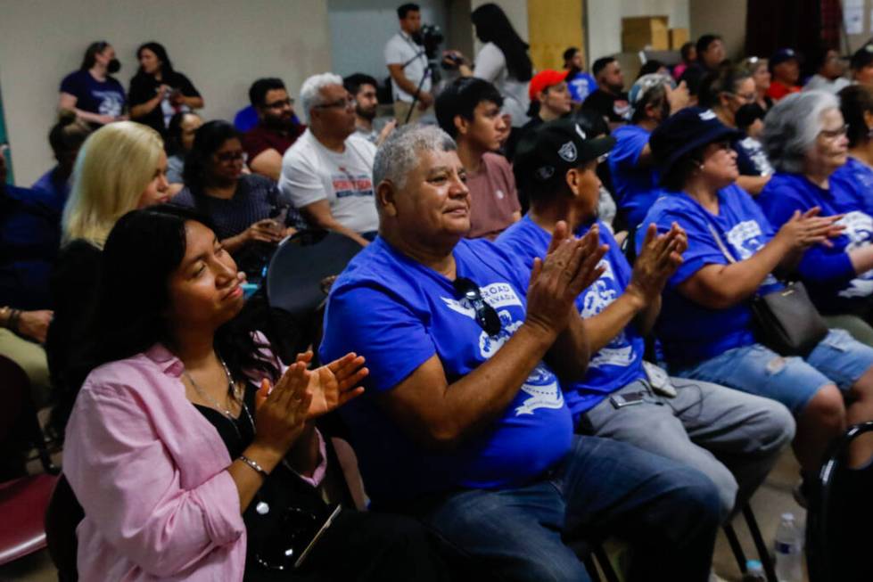Marina Bahena, left, Manuel Cazares, second left, and other members of Make The Road Nevada cla ...