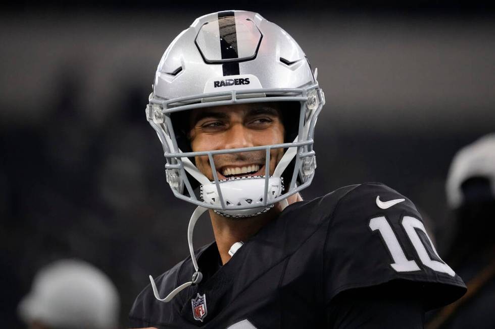 Las Vegas Raiders quarterback Jimmy Garoppolo warms up before a preseason NFL football game aga ...