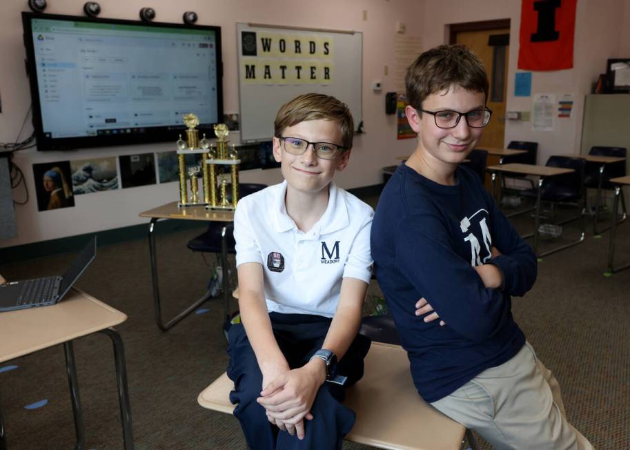 Seventh grader Elliot Lefebvre, left, and pose for a photo at The Meadows School in Las Vegas ...