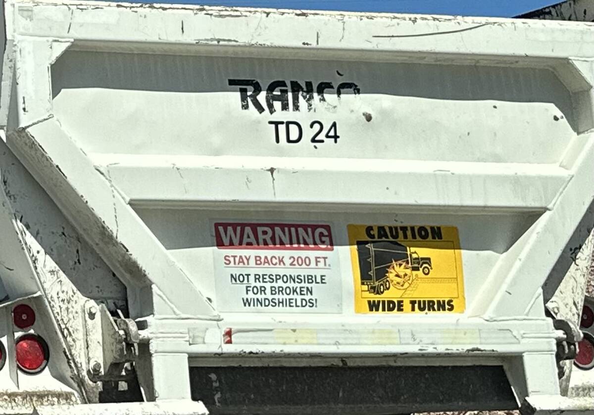 A warning sign posted on the back of dump truck seen on Interstate 11 in Henderson on Tuesday A ...