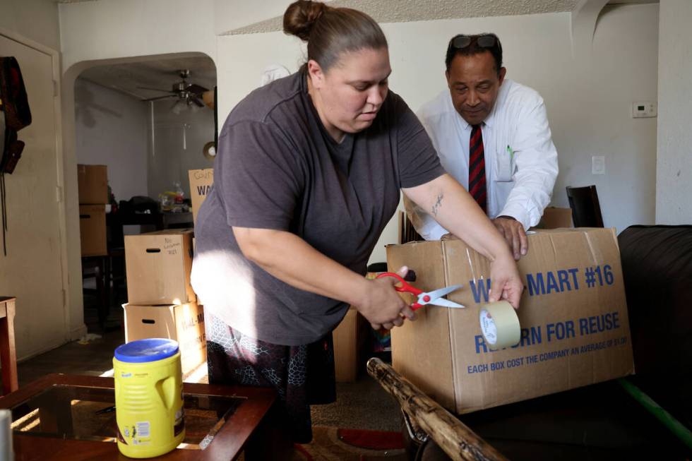 Burke Hall, right, prepares to move with the help of friend Veronica Muncy at his Las Vegas apa ...