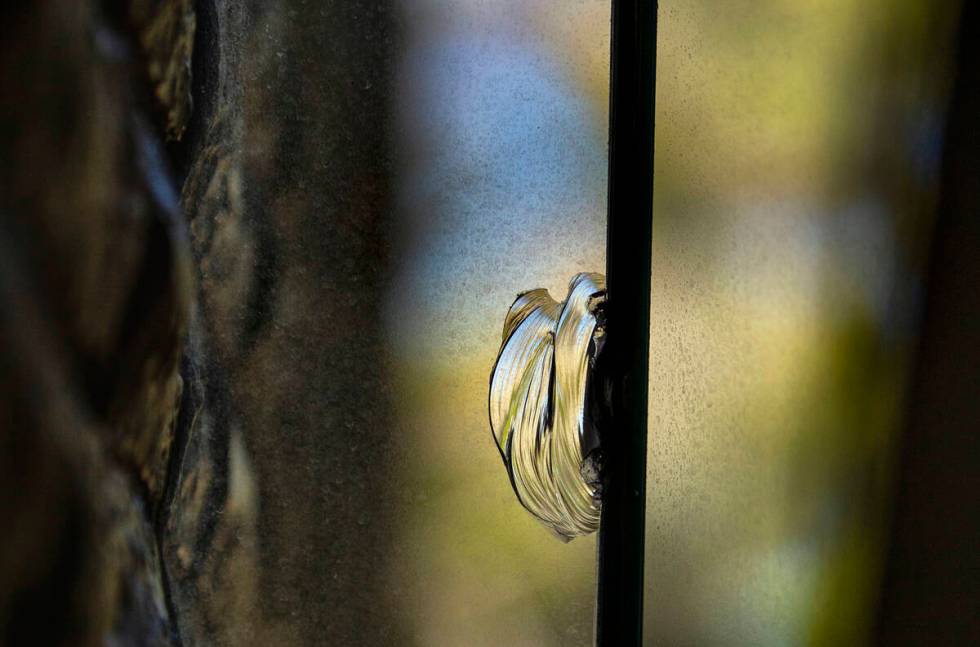A chip in a window believed to have been caused by bullet at Lefty Rosenthal's former home on M ...