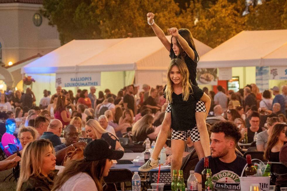 Two young festivalgoers feel the music at the 2022 Las Vegas Greek Fest at St. John the Baptist ...