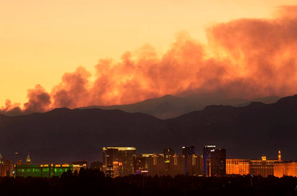 Smoke from the Carpenter 1 Fire rises over the Strip in Las Vegas on Tuesday, July 9, 2013. (La ...