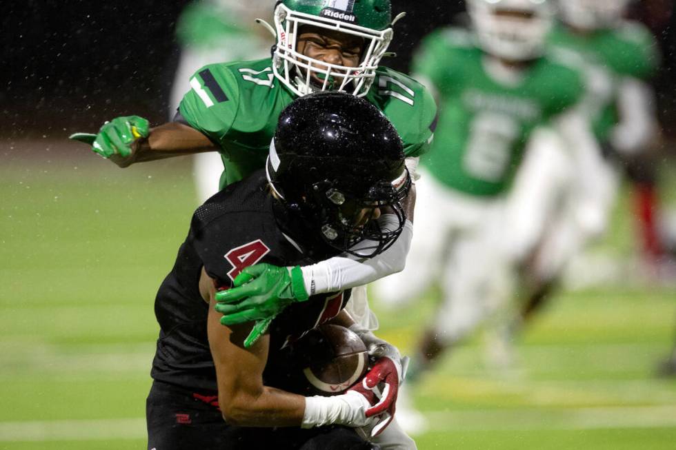 Rancho's Deion Green (17) takes down Las Vegas' Julian Torres (4) during the first half of a hi ...