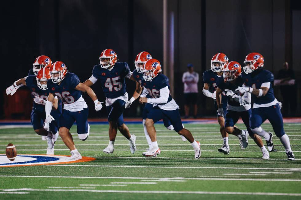 Bishop Gorman football players run after a loose ball during a game against Miami Central at Bi ...