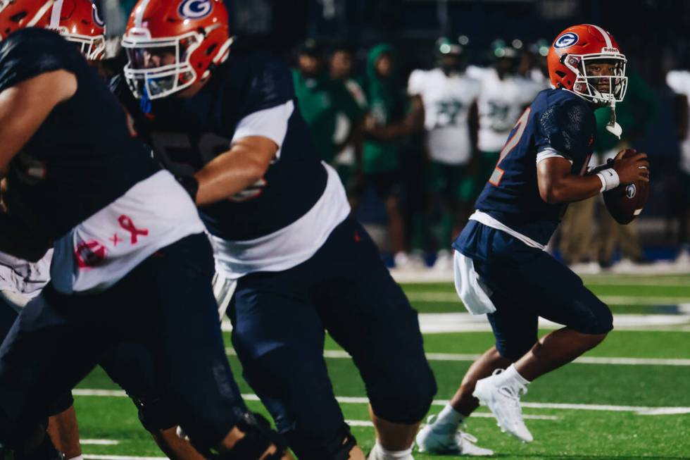 Bishop Gorman quarterback Micah Alejado (12) looks to pass the ball to a teammate during a game ...