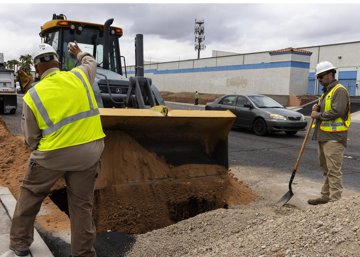 Traffic is backed up as crews continue to repair a large sinkhole near Jones Boulevard and Roch ...