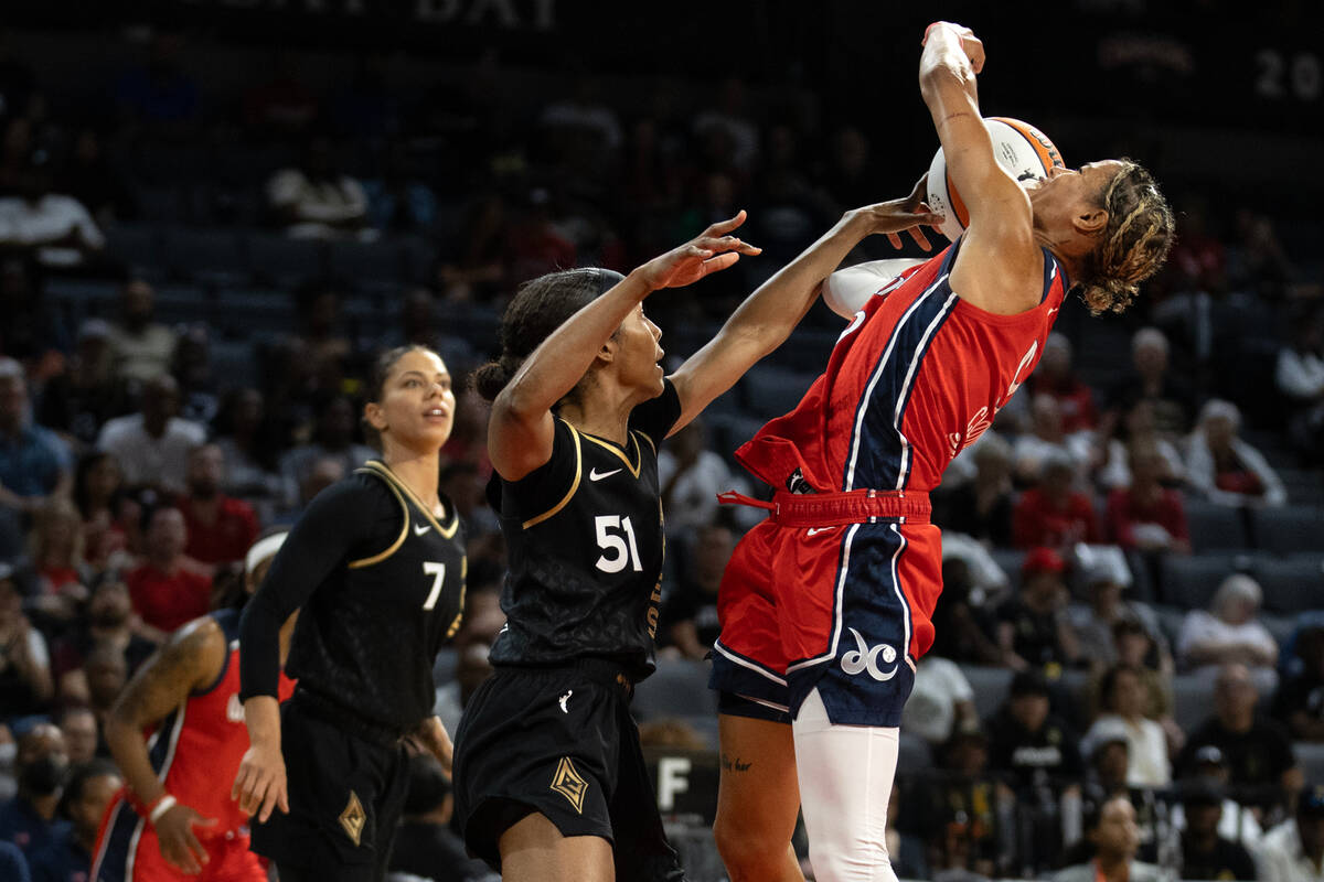 Washington Mystics guard Natasha Cloud (9) shoots against Las Vegas Aces guard Sydney Colson (5 ...