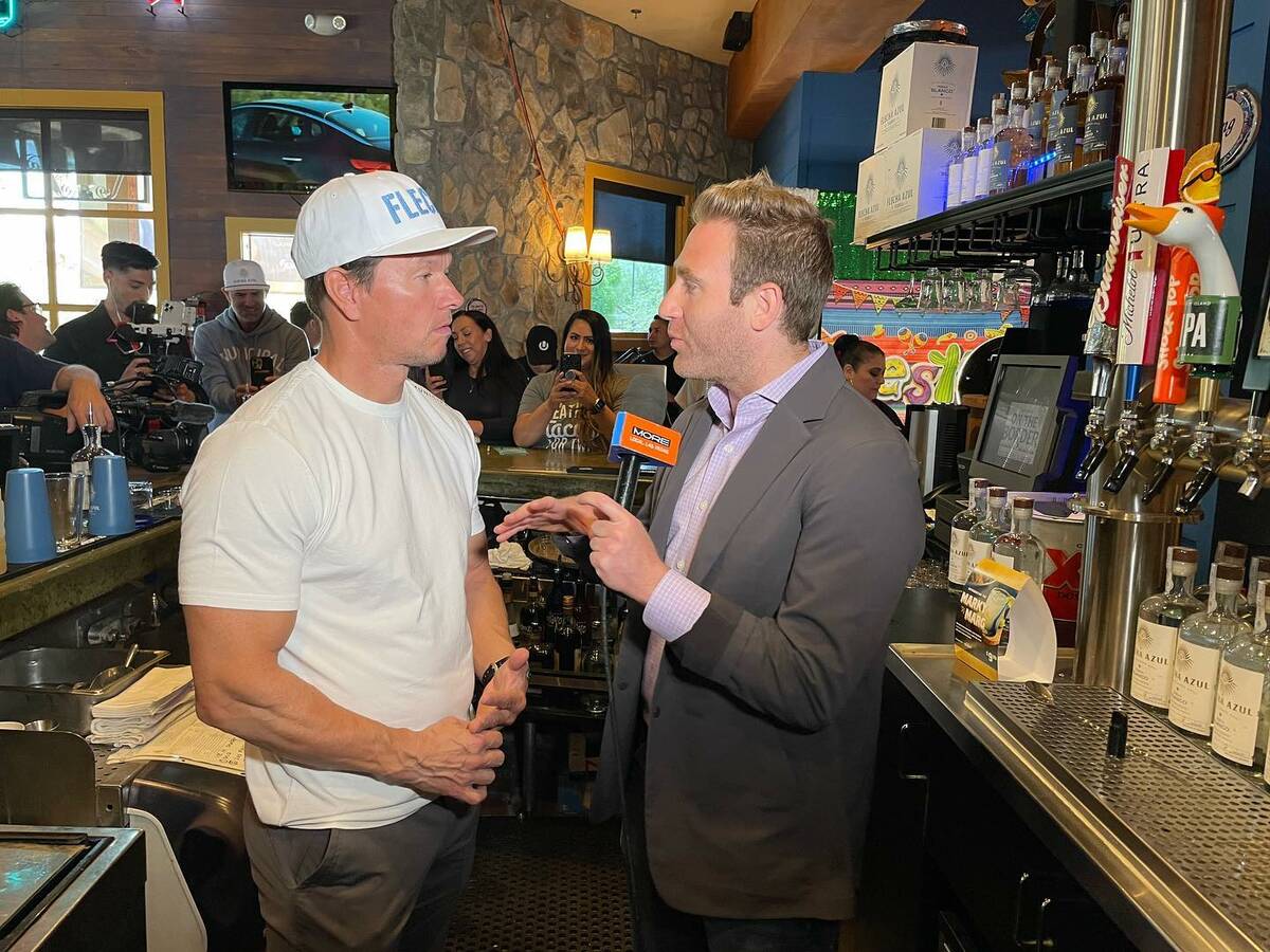 Mike Davis shown interviewing Mark Wahlberg at Wahlburgers at the Shoppes at Mandalay Place. Da ...