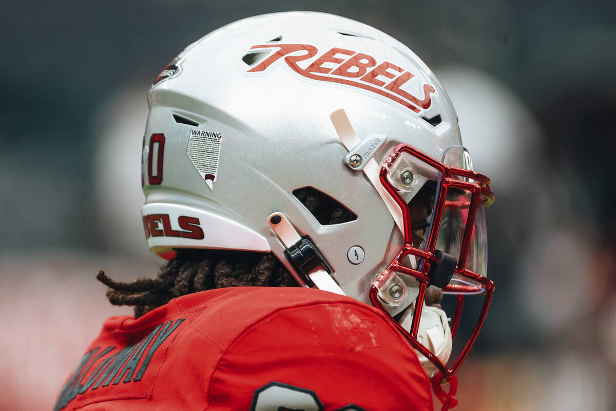A player wears his UNLV helmet before a game against Bryant at Allegiant Stadium on Saturday, S ...