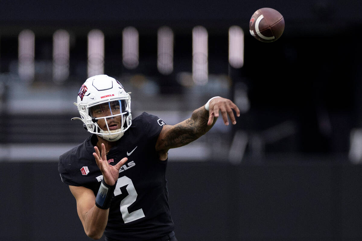 Quarterback Doug Brumfield (2) passes during the UNLV spring showcase game at Allegiant Stadium ...