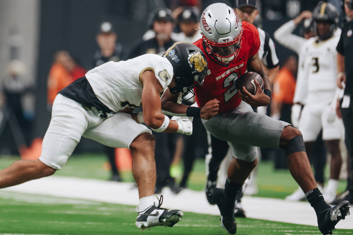 UNLV quarterback Doug Brumfield (2) runs the ball near the end zone during a game against Bryan ...