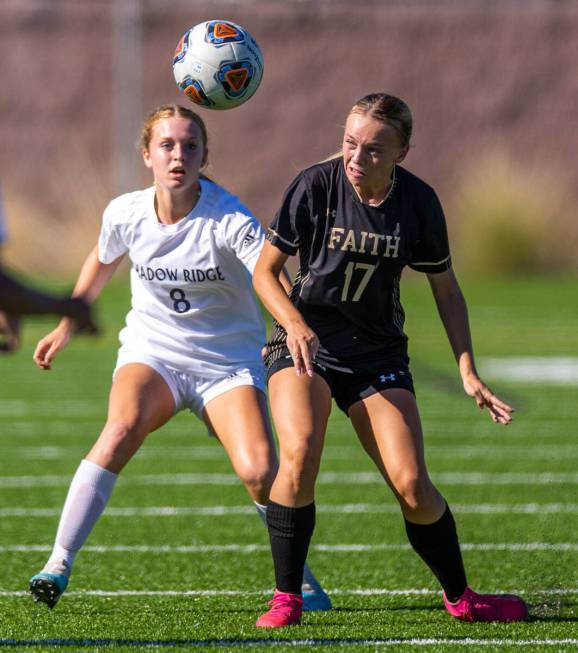 Shadow Ridge midfielder Harmony Taylor (8) eyes the ball with Faith Lutheran forward Julia Anfi ...