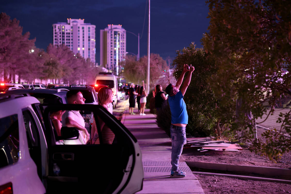 The Sphere lights up people on Manhattan Street near the Strip in Las Vegas Wednesday, Aug. 16, ...