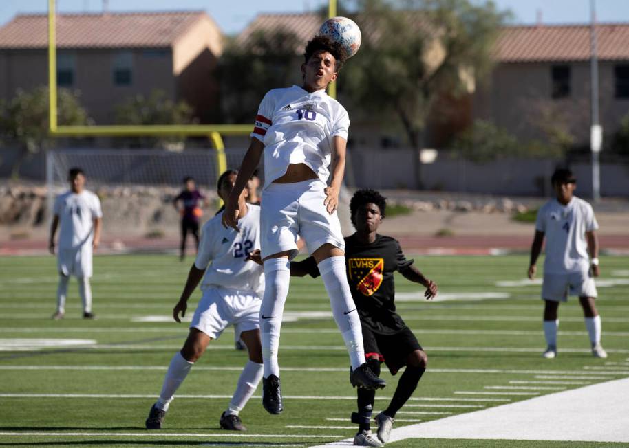 Sunrise Mountain's Michael Umana (10) heads the ball during a boys high school soccer game agai ...