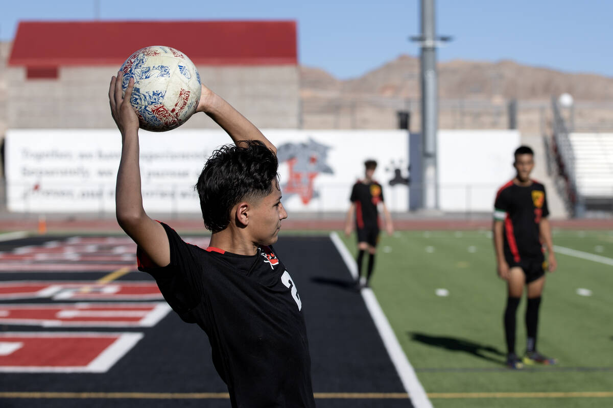 Las Vegas' Valentin Mendoza (21) throws in during a boys high school soccer game against Sunris ...