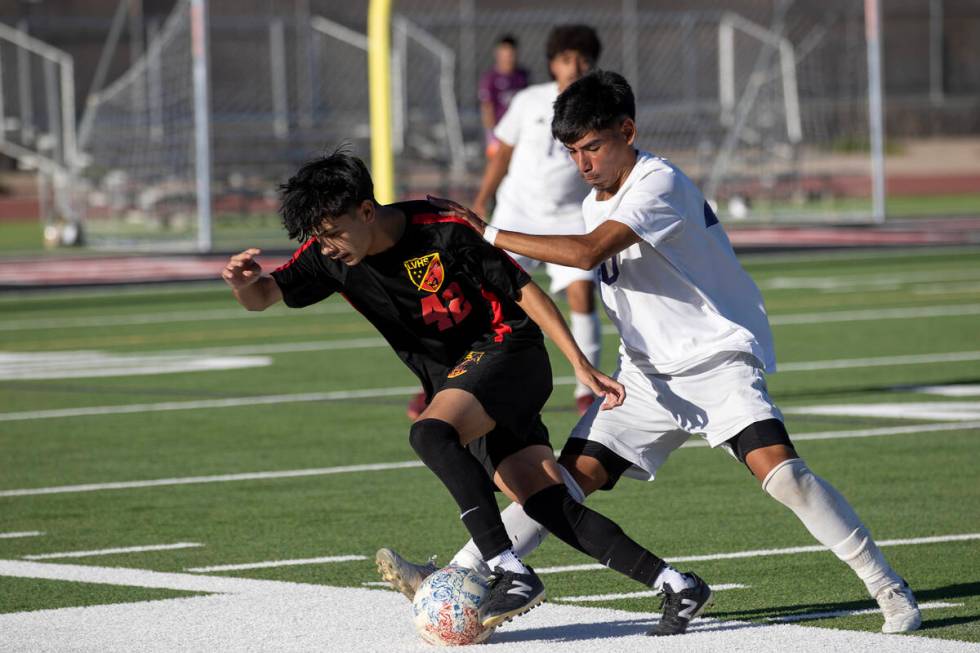 Las Vegas' Lex Madrigal (42) works to keep the ball inbounds while dribbling against Sunrise Mo ...