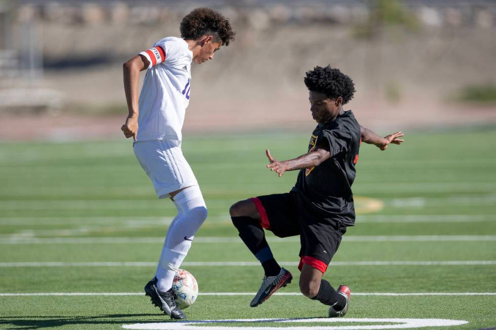 Sunrise Mountain's Michael Umana (10) dribbles against Las Vegas' Bautista Silva (32) during a ...