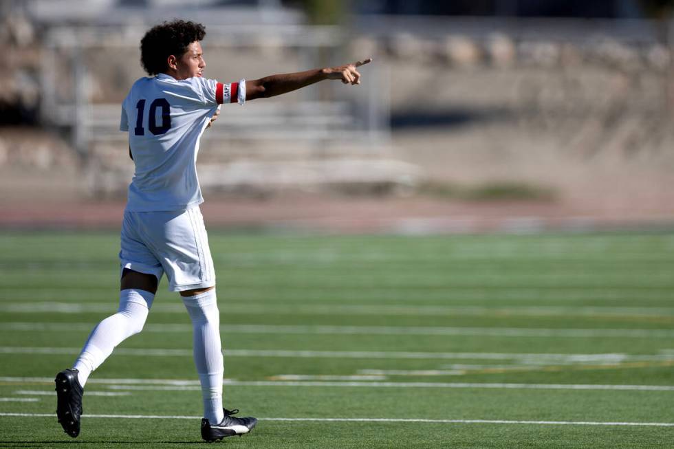 Sunrise Mountain's Michael Umana (10) gestures to the stands after scoring a goal during a boys ...
