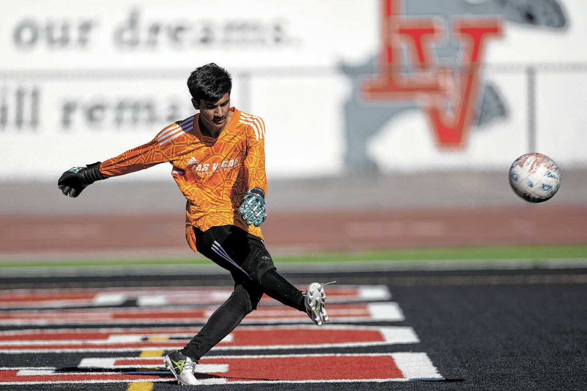 Las Vegas' goalkeeper Byron Medina kicks the ball into play during a boys high school soccer ga ...