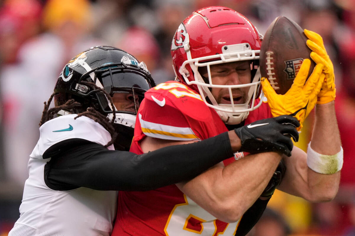 Kansas City Chiefs tight end Travis Kelce (87) makes the catch against Jacksonville Jaguars saf ...