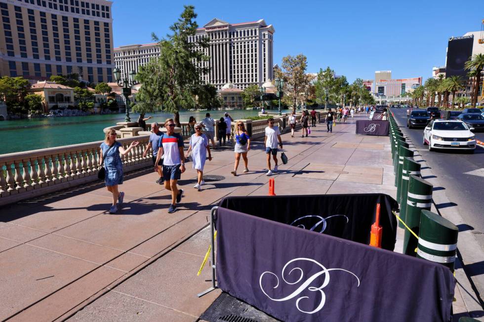 Barricades block off stumps from trees cut down in front of the Bellagio on the Strip in Las Ve ...