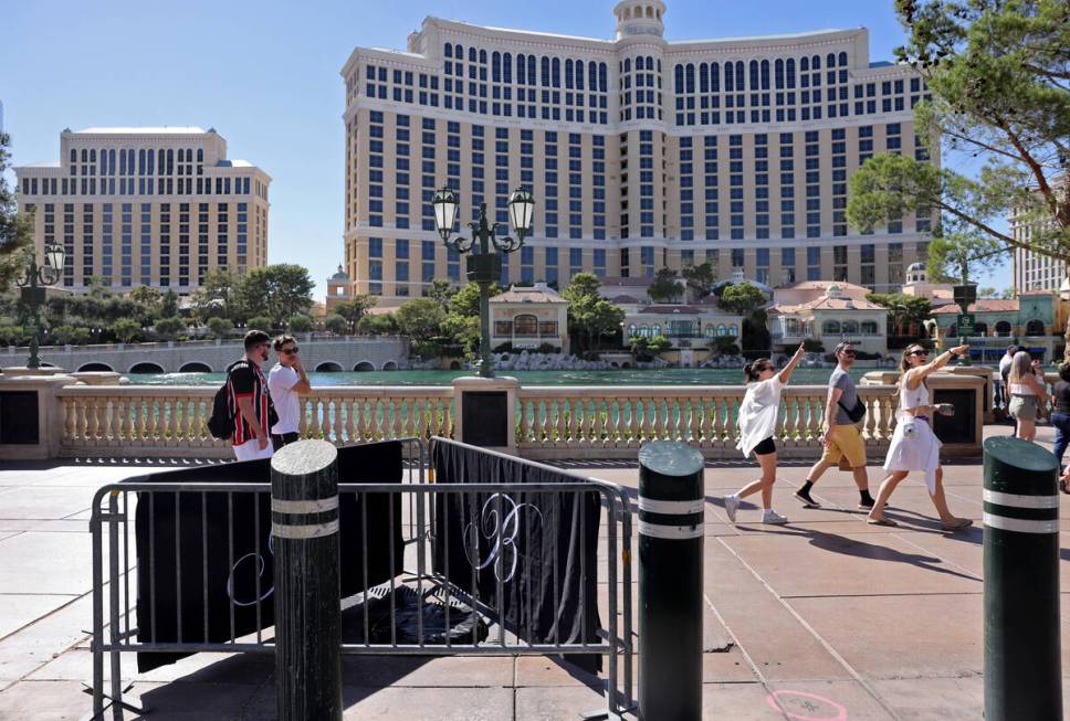 Barricades block off stumps from trees cut down in front of the Bellagio on the Strip in Las Ve ...