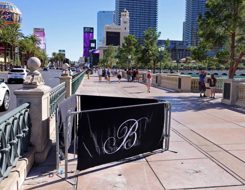 Barricades block off stumps from trees cut down in front of the Bellagio on the Strip in Las Ve ...