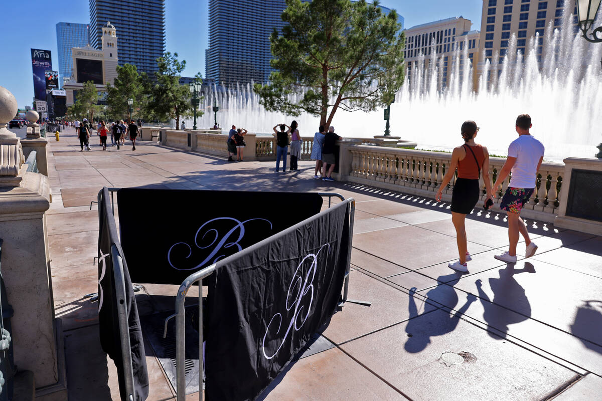 Barricades block off stumps from trees cut down in front of the Bellagio on the Strip in Las Ve ...