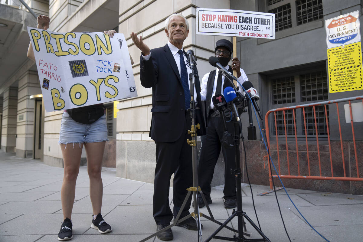 Former White House trade adviser Peter Navarro speaks to the media as he departs federal court, ...