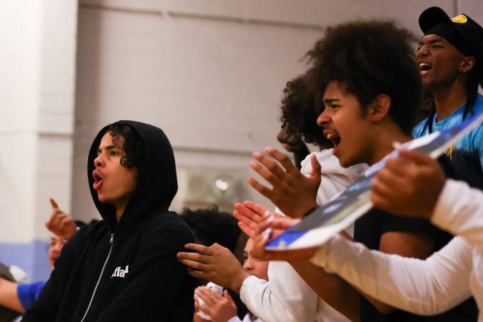 Centennial High School students cheer on their school during a volleyball game between Centenni ...