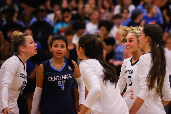 Centennial High School celebrates a point during a volleyball game between Centennial High Scho ...