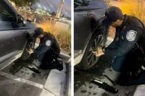 Officers Jenna Robins and Joseph Hogans (shown) of the North Las Vegas Police Department help a ...