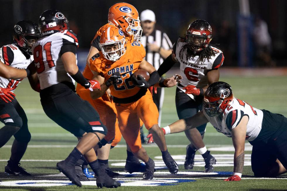 Bishop Gorman running back Micah Kaapana (22) weaves through Centennial’s defense during ...