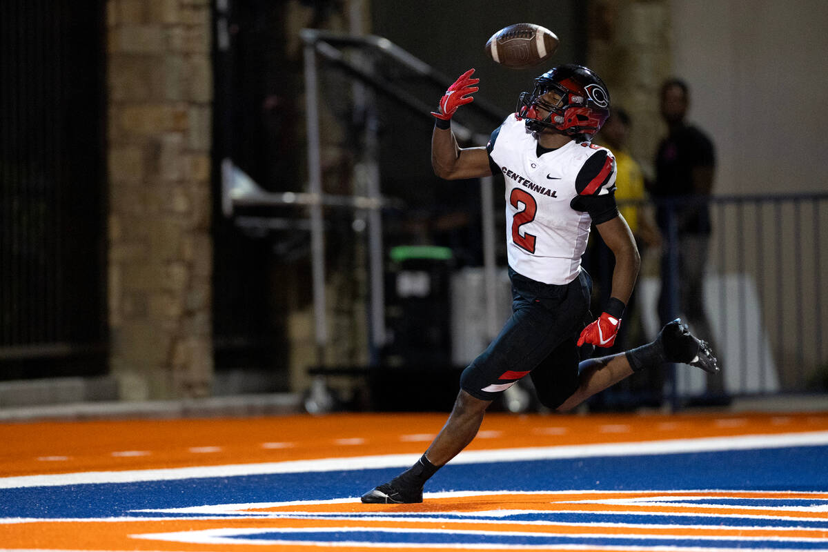 Centennial running back Cornell Hatcher, Jr. (2) scores a touchdown during the first half of a ...