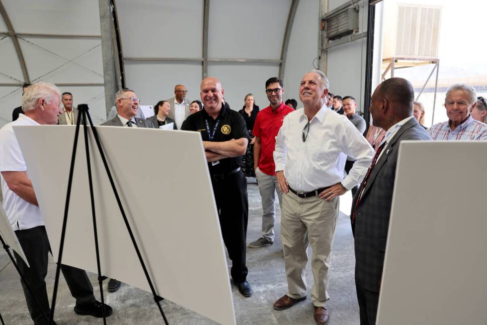 Gov. Joe Lombardo, center, tours the under construction Vocational Village site at Southern Des ...