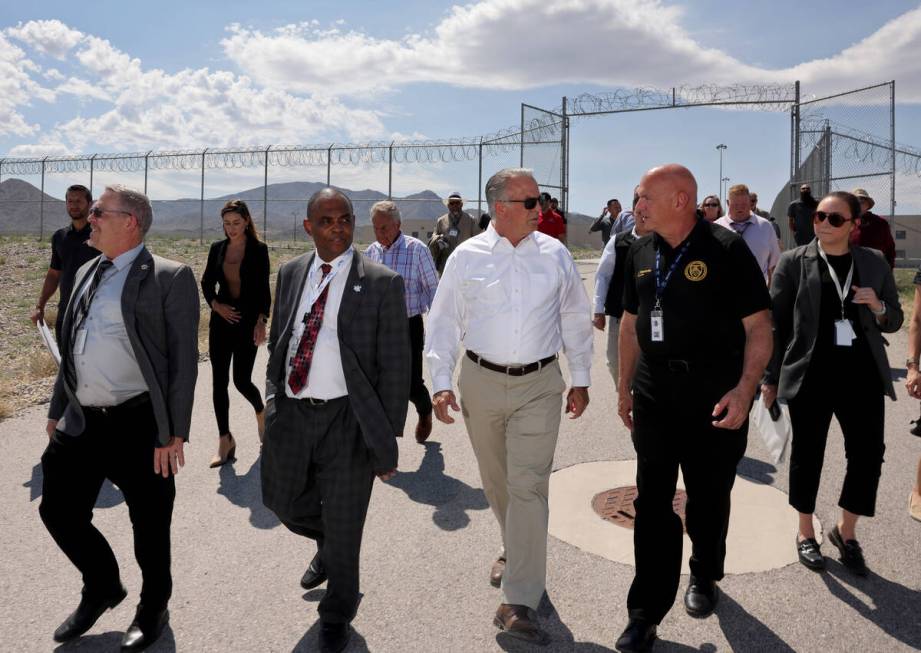 Gov. Joe Lombardo, center, tours the under construction Vocational Village site at Southern Des ...