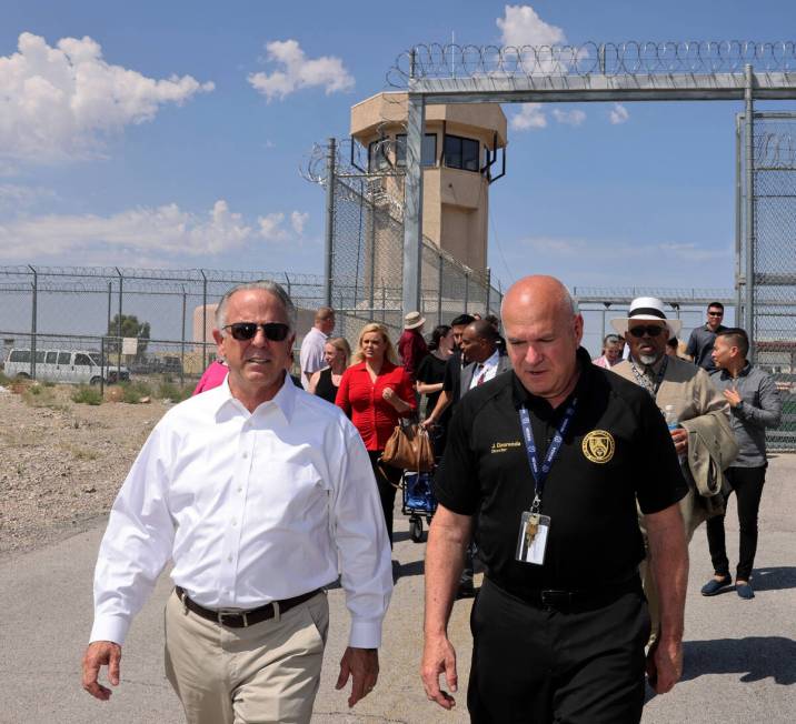 Gov. Joe Lombardo, left, tours the under construction Vocational Village site with Nevada Depar ...