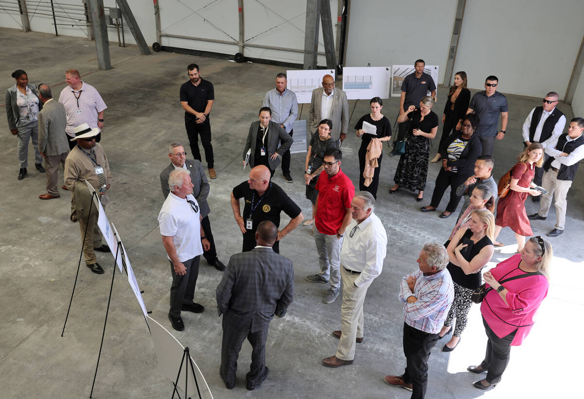 Gov. Joe Lombardo, center, tours the under construction Vocational Village site at Southern Des ...