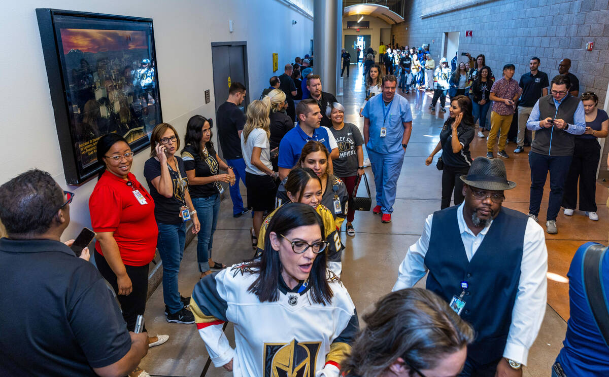 UMC Hospital workers line up down the hall waiting for their moment with the Stanley Cup during ...