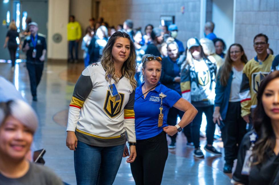 UMC Hospital workers line up down the hall waiting for their moment with the Stanley Cup during ...