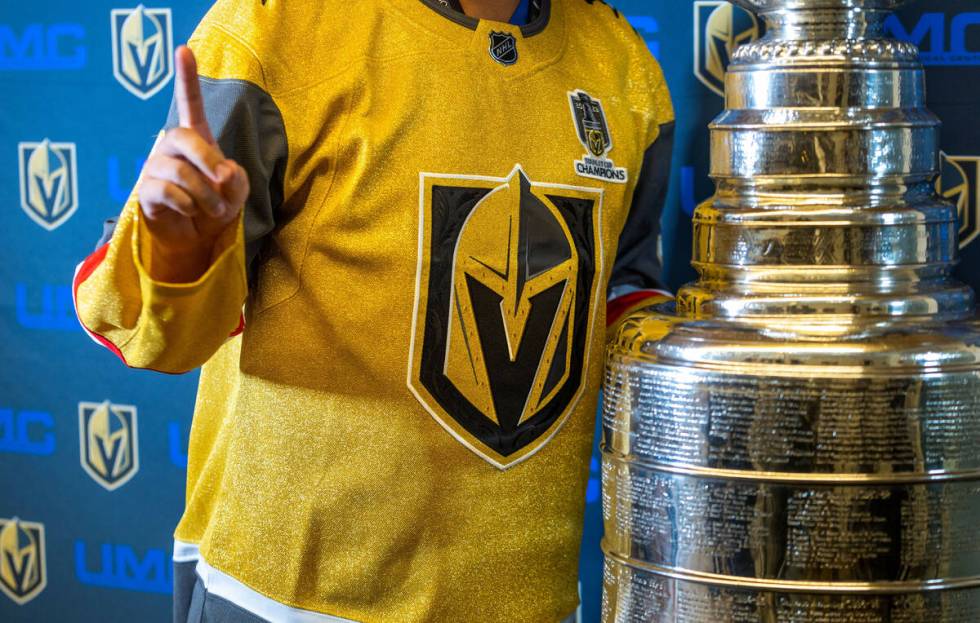 A UMC Hospital worker poses with the Stanley Cup during a visit for employees presented by the ...