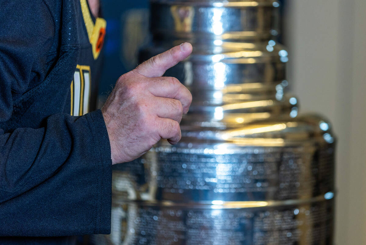 A UMC Hospital worker poses with the Stanley Cup during a visit for employees presented by the ...