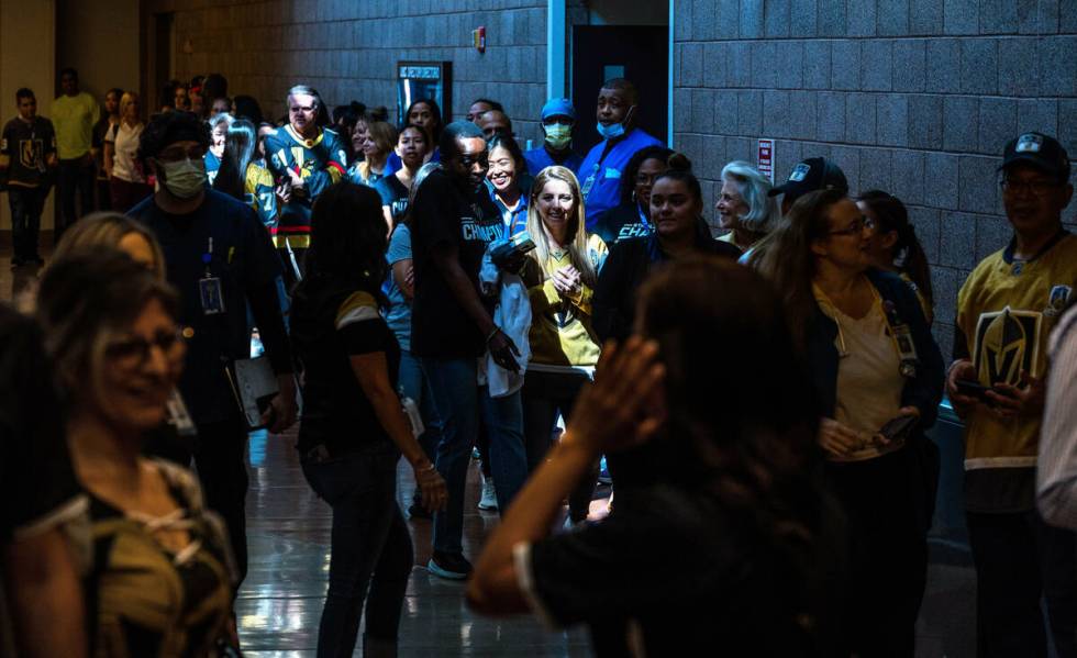 UMC Hospital workers line up down the hall waiting for their moment with the Stanley Cup during ...