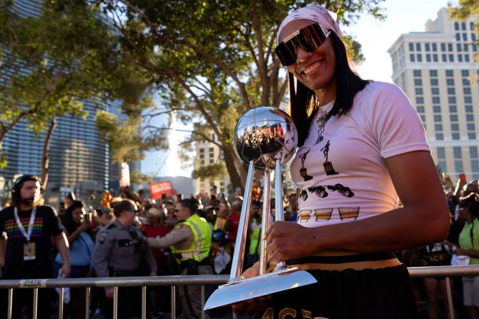 Las Vegas Aces forward A'ja Wilson, also the 2022 WNBA MVP, holds up the WNBA Championship trop ...