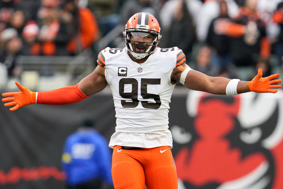 FILE -Cleveland Browns defensive end Myles Garrett (95) reacts after recording a sack during an ...