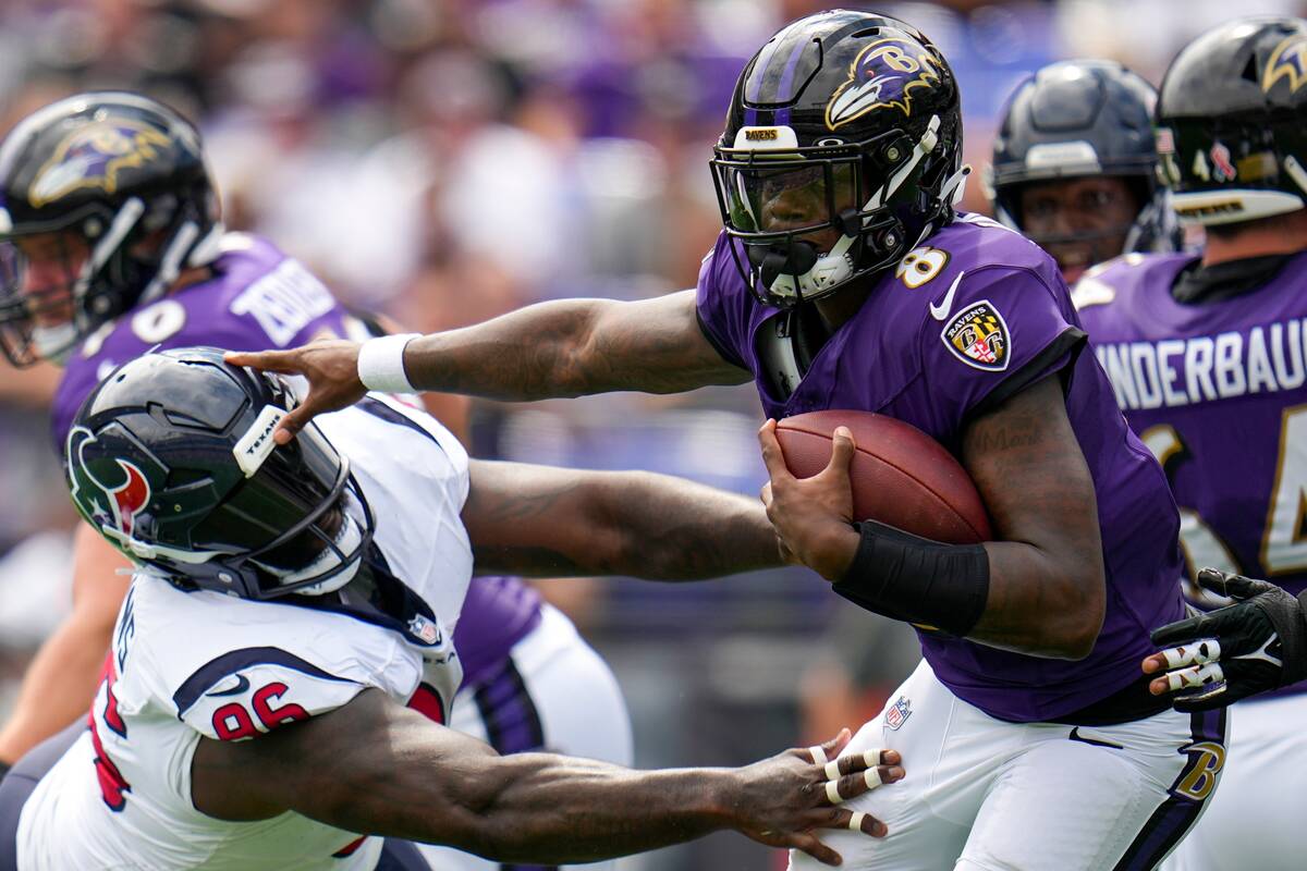 Houston Texans' Maliek Collins tries to stop Baltimore Ravens' Lamar Jackson during the first h ...